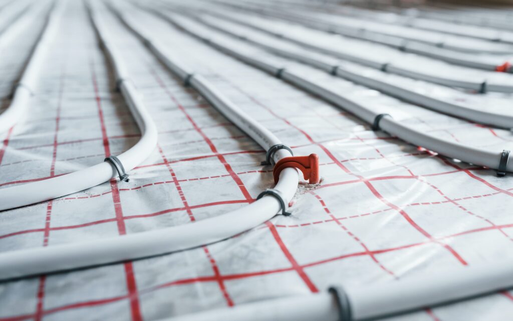 Pipes of underfloor heating system. Close up view. No people